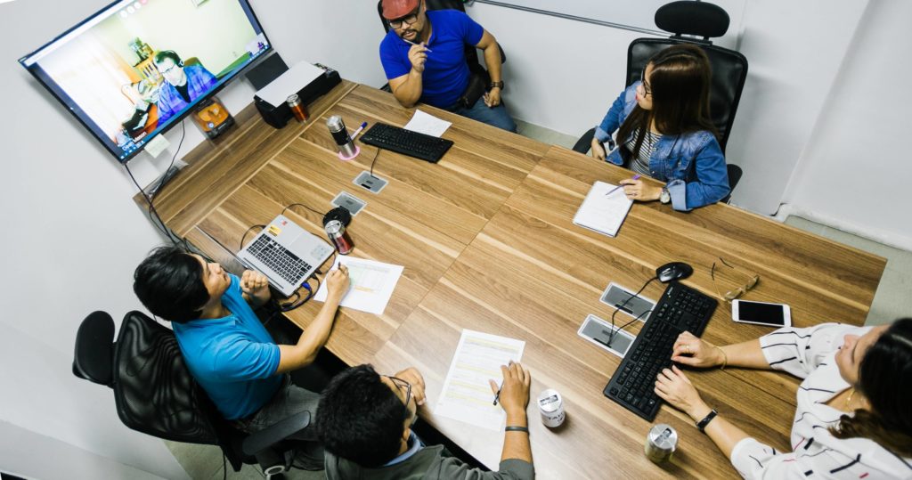 Tahche employees having a meeting ina conference room